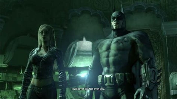 How do I glide in "Batman: Arkham City" during the "Demon Trials"?
