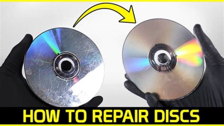 How do I repair a scratched game disc?