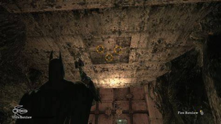 Where's the entrance to the caves from Arkham West in Batman: Arkham Asylum?